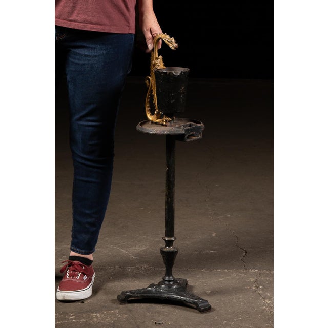 Early 20th-century figural floor ashtray by Scroll Art Mfg. Co. of Bridgeport, Connecticut, featuring a gilt dragon...