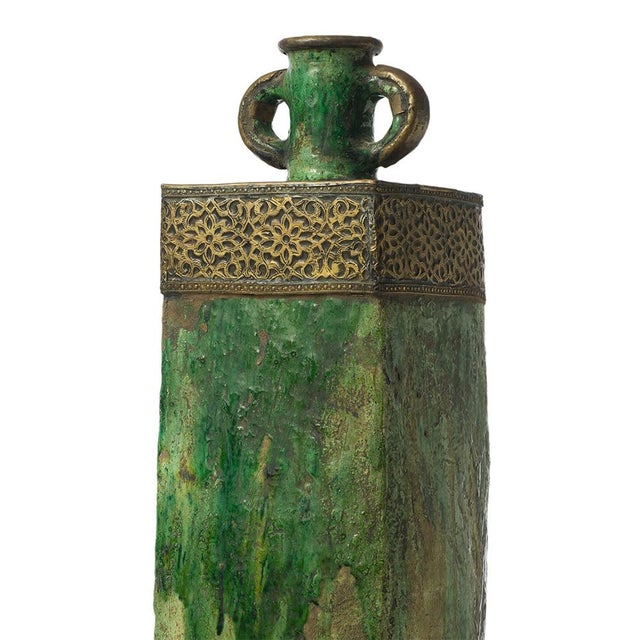 This handcrafted Tamegroute ceramic vase showcases a rich green glaze layered with natural variations, complemented by...