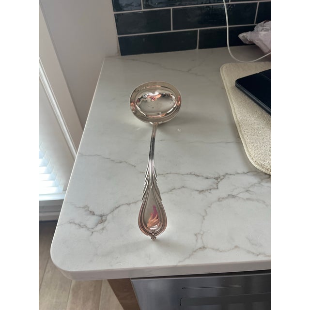 Elegant serving ladle with detailed handle and lovely curve. It was purchased at a vintage market in beautiful Surrey...