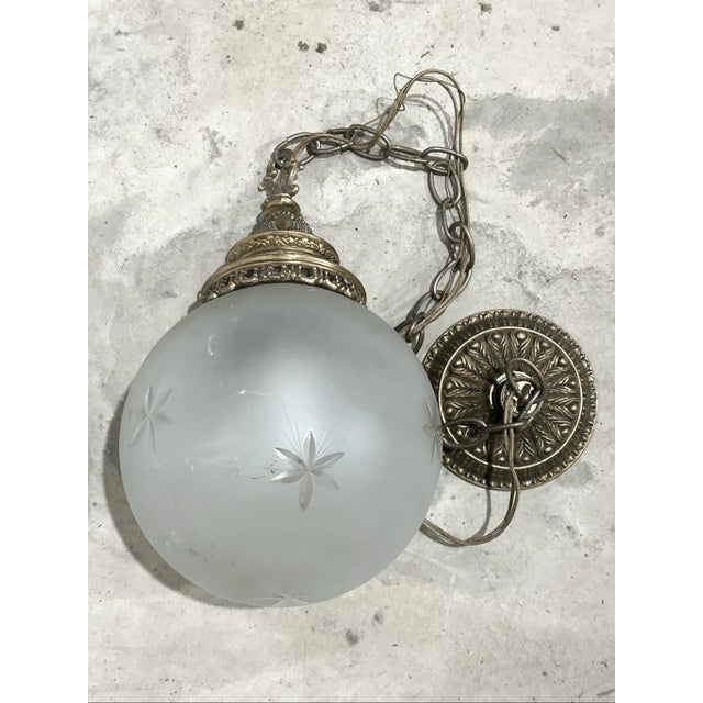 39” overall height 27” chain 8” diameter Good condition Add a touch of timeless elegance to your space with this exquisite...