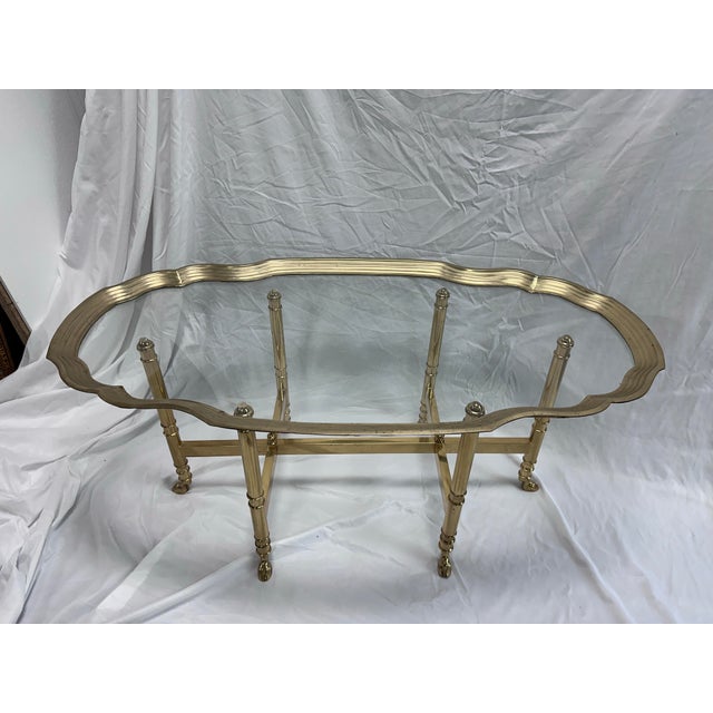 The Vintage La Barge Scalloped Brass and Glass Coffee Table is a timeless piece that will effortlessly complement any...