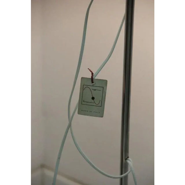 Vintage floor lamp made in the 1970s by Italian company Reggiani. It is made from chromed metal and features two lights....