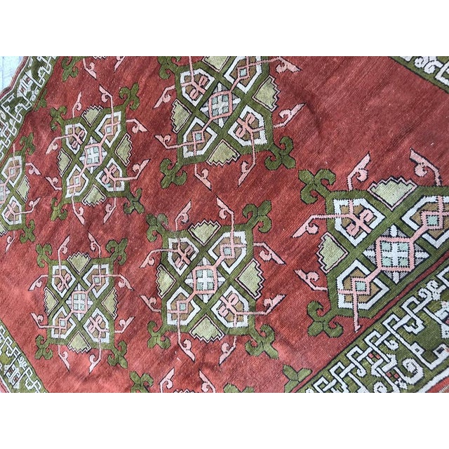 Beautiful early 20th century Turkish rug with a decorative design and green and pink salmon colors, entirely hand knotted...