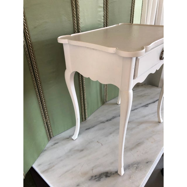 A charming and authentic 19th-century French Provincial side table, featuring a beautifully aged lime-painted finish with...