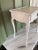 A charming and authentic 19th-century French Provincial side table, featuring a beautifully aged lime-painted finish with...