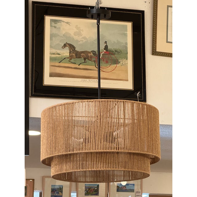 Design Plus Gallery presents a Tiered Rope Wrapped Pendant with Boho Style. The metal structure of this fixture has two...