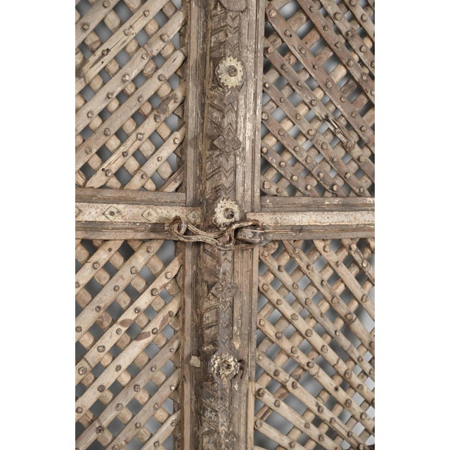 Antique Indian Carved and Sun Bleached Teakwood "Jali" Trellis Door, late 19th century from Rajasthan, features a trellis...