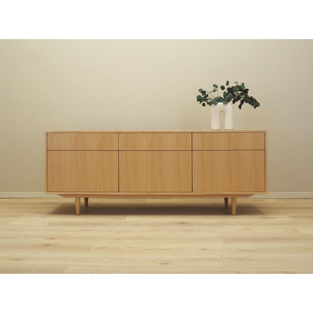 The dresser was made in the Scandinavian style. The structure is covered with oak veneer. Legs made of solid wood. Surface...