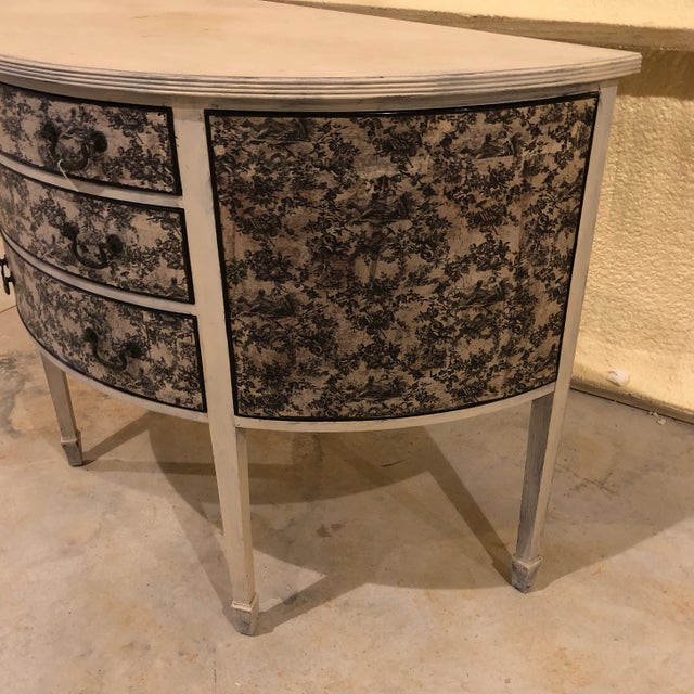Traditional English Georgian style demilune with flair. Distressed painted finish with classical toile decoration. 3...