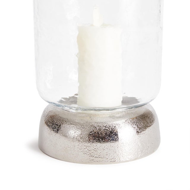 With a cool chrome finish and a domed base, this hurricane is a fresh accent for dining table, console or bookshelf. The...