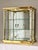 Striking Mastercraft style brass and glass mirrored table/countertop showcase vitrine cabinet. It features a tempered...