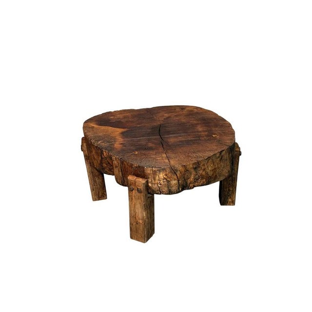 An original coffee table crafted from a single walnut trunk, dating back to the early 1900s. The round shape and textured...