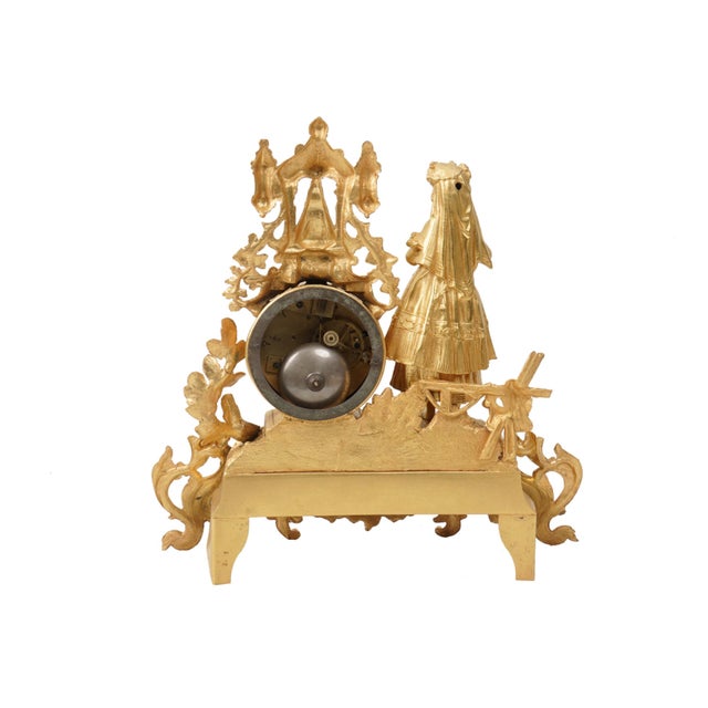 Bring classic 19th-century European elegance to your home with this exquisite Antique French Gilt Metal Mantel Clock....