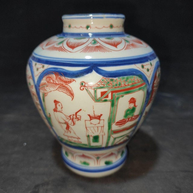 This charming Wucai (polychrome) style porcelain jar features a classic, rounded silhouette with a short neck. The body is...