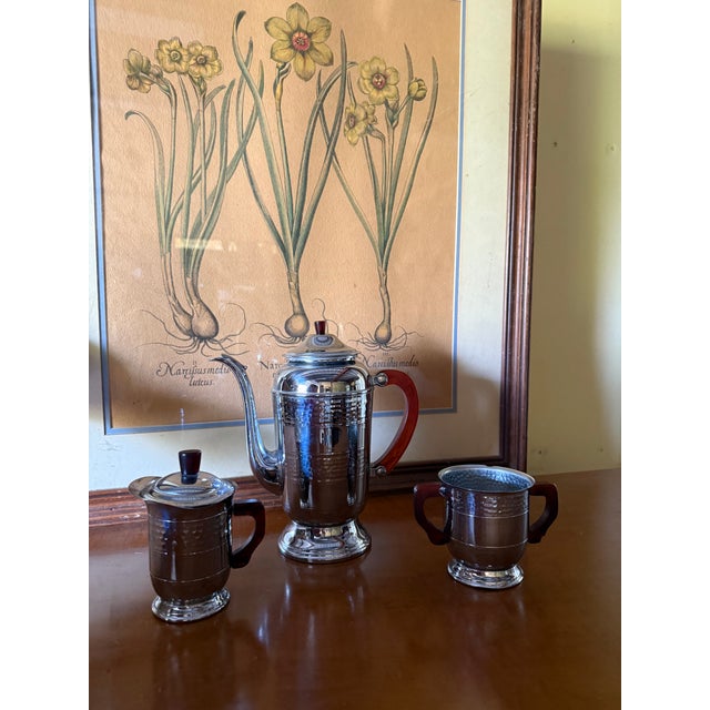 Charming Oneida chrome plated metal coffee pot, sugar and creamer set with lids.
