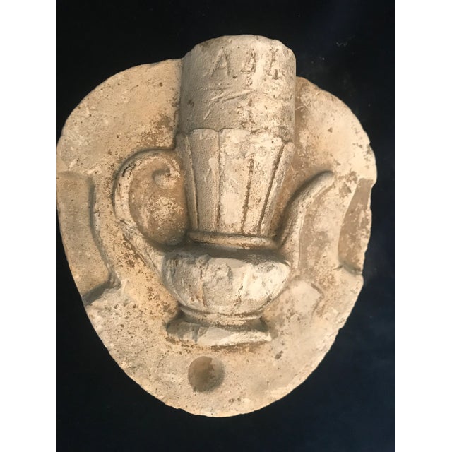 Neoclassical style wall art with Grecian urn. Great aged patina. Inscribed with ‘A B 4 c’ at the top. Wall hanger in back....