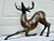 This graceful brass deer statue is beautifully colored. Standing almost 16 Inches high, it would make a great conversation...