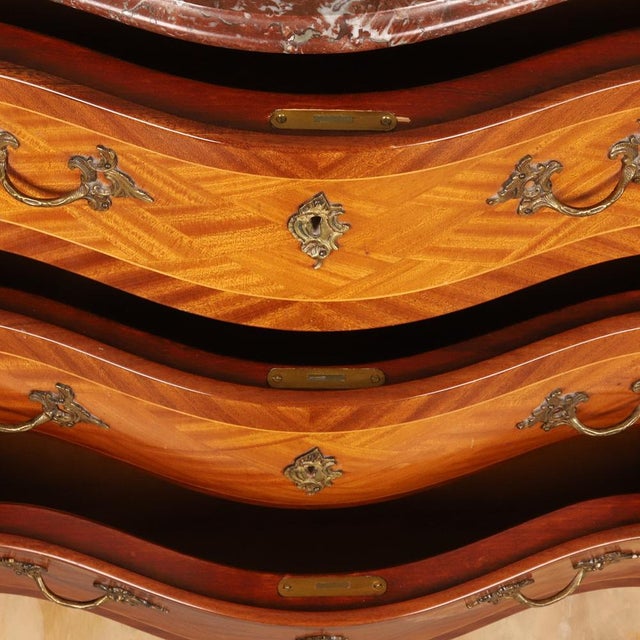 Marquetry Chest of Drawers in Mixed-Wood Veneer with Brass Mounts and Marble Top, 1920s, in Good conditions. Designed 1920...