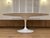 This beautiful mid-century replica of the Saarinen tulip table will add elegance to any dining space. Its pure white...