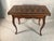 This elegant 18th-century italian backgammon game table combines sophisticated marquetry with a clever, functional design....