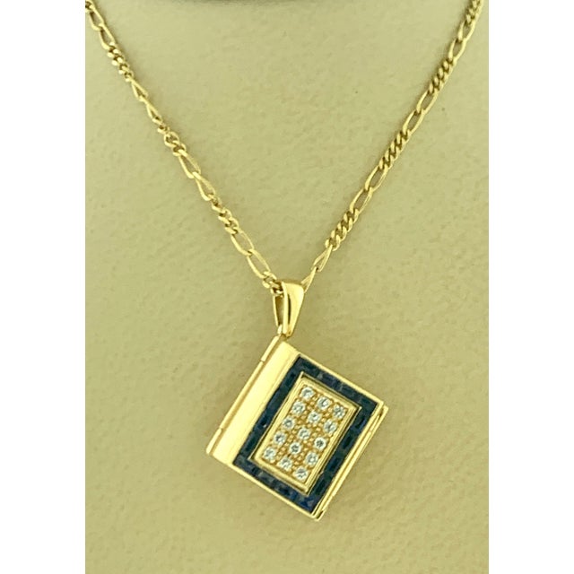 A beautiful Book Pendent with Two sleeves , each sleeve has two pages. All pages are made of mother of pearl . Made in 18...