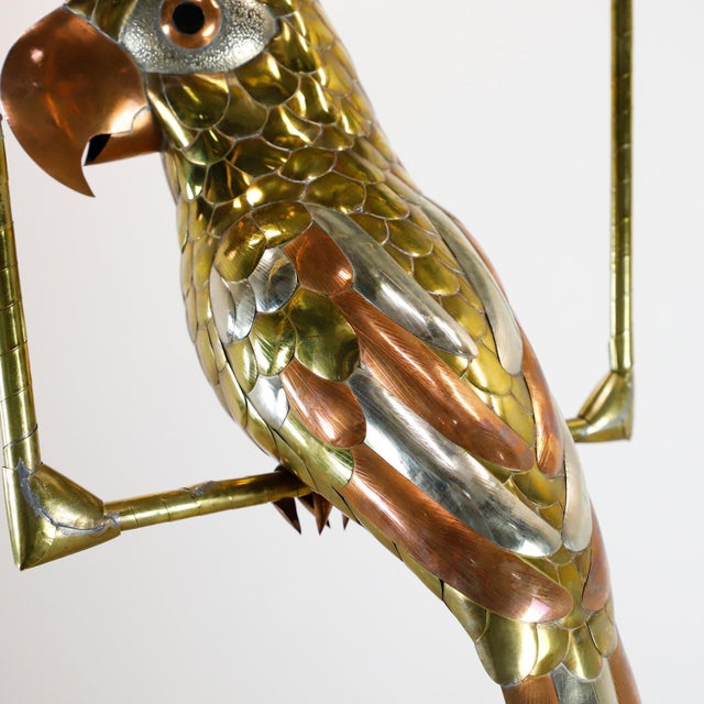 We offer this macaw sculpture attributed to Mexican artist Sergio Bustamante, circa 1960 made in a beautiful mixed metals...