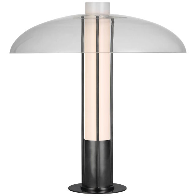 Troye Medium Table Lamp in Bronze with Clear Glass Designer: Kelly Wearstler Height: 19" Shade Detail: Clear Glass Base:...