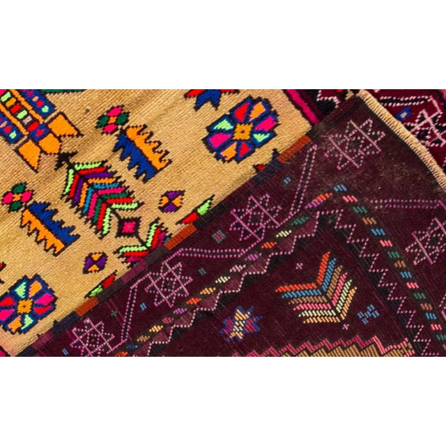 Vintage 1970s Turkish Anatolian runner. This piece has a light tan/beige field with a bright multicolored tribal design...