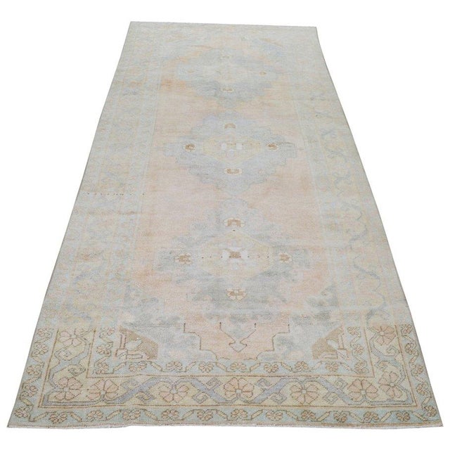 Hand-knotted with care using traditional rug-making techniques, this wool rug blends timeless craftsmanship with a modern...