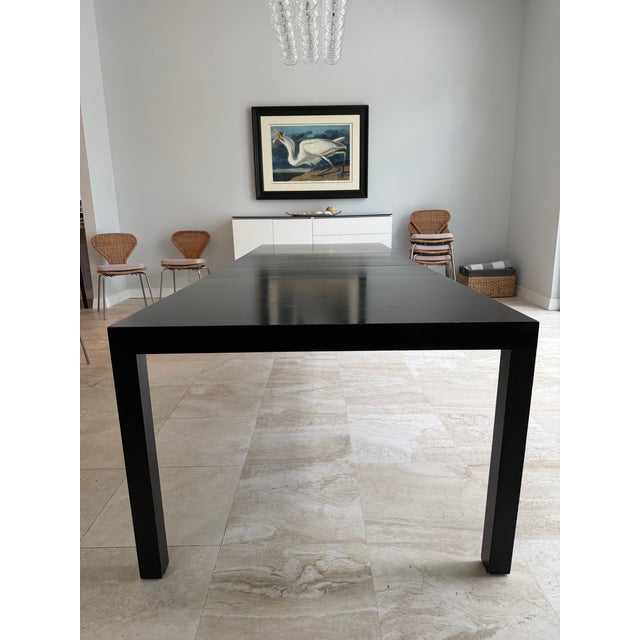 Giant Black Lacquered Parsons Table with 3 leaves and storage for the leaves. Best party table ever! Seats 10-12 at full...
