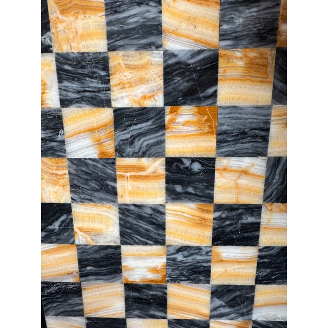 Vintage chess or checkers board made from gorgeous onyx and black marble. Just over 11" square.