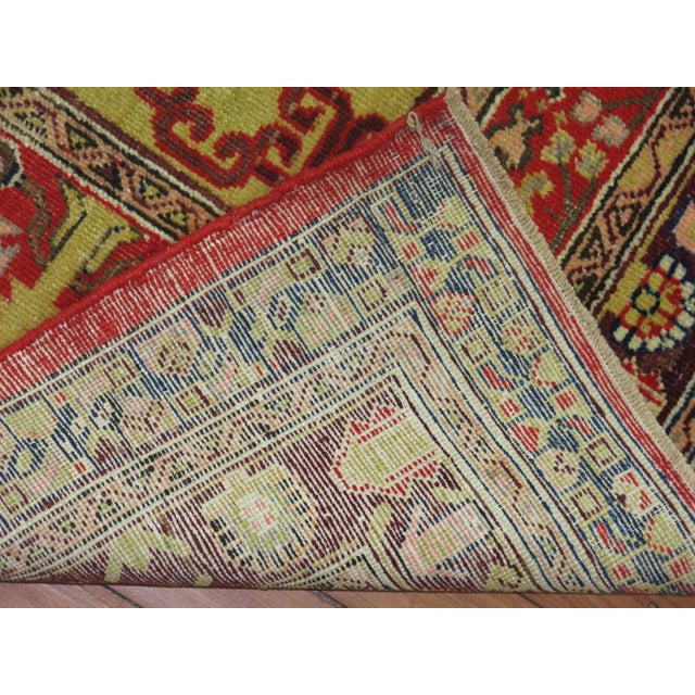 A colorful East Turkestan Khotan rug from the early 20th century Measures: 4'4" x 9'1'' Khotan, an ancient Buddhist...
