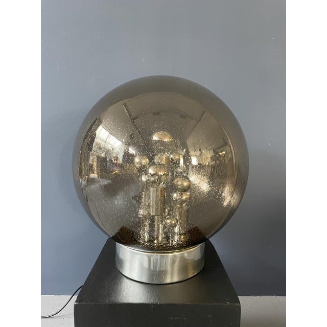 Illuminate your space with design and warmth through our glass globe lamp—a stylish fusion of contemporary design and...