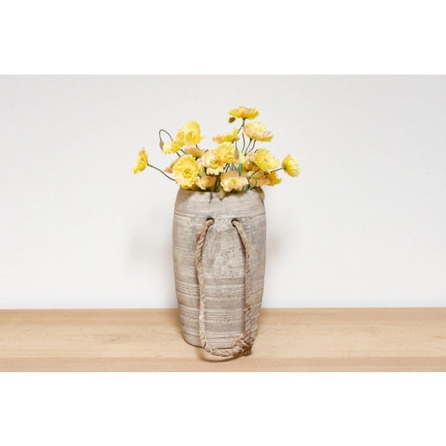 This charming antique carved wood pot was crafted from teak and originally used in Village kitchens in North India to...