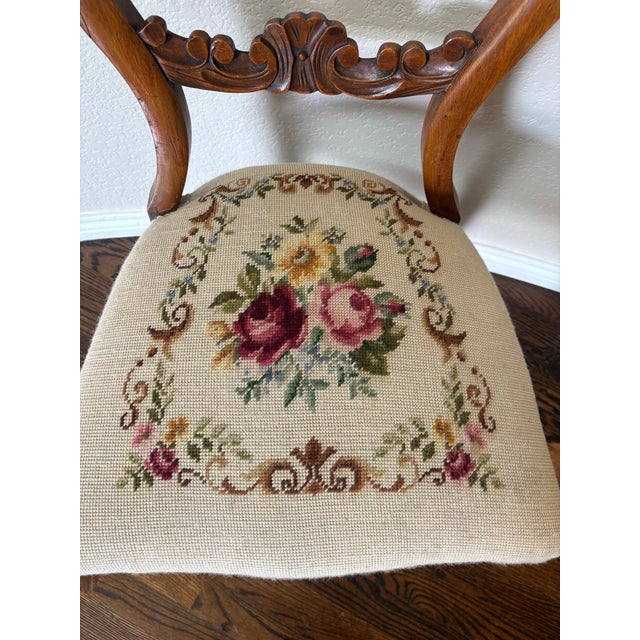 A beautifully carved antique Victorian Rococo Revival balloon-back side chair, dating to approximately 1880–1910,...