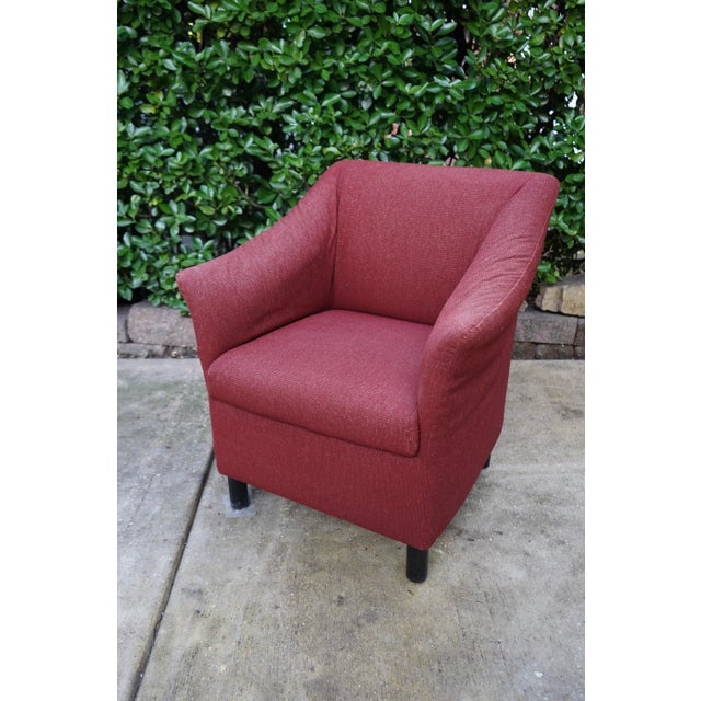 Brayton International club chair featuring wing arms, brick red upholstery and round black feet. Very attractive back,...