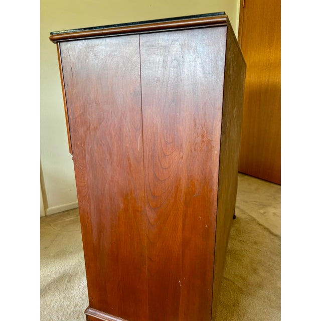 The 9 Drawer Cherry Wood Chest is a timless heirloom that blends high-capacity, organized storage with refined aesthetic...