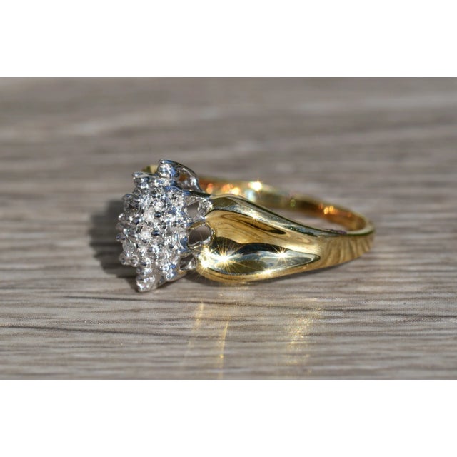 The Crisanto Ladies Contemporary Two Tone Diamond Cluster Cocktail Ring. Crafted in yellow gold, this ladies ring features...