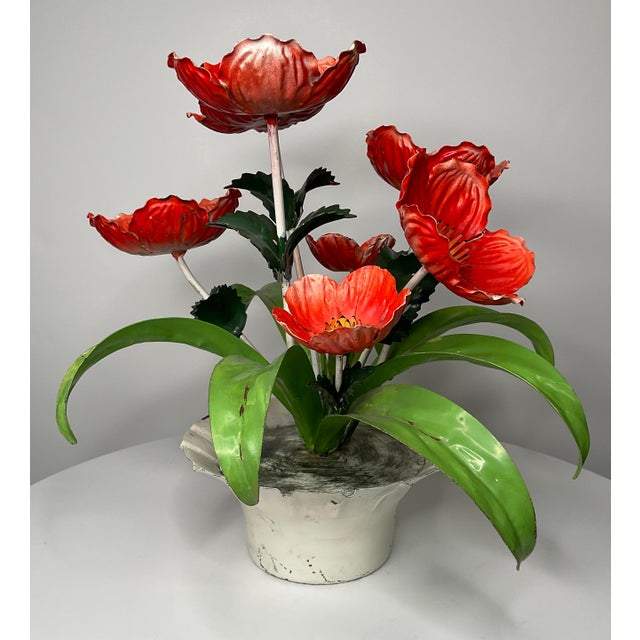 Florintia metal poppy sculpture is vintage toile. Seven poppies and six leaves make up this whimsical floral display....