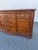 Thomasville British Gentry burled wood nine drawer dresser. It features burl oak panels and antiqued brass hardware .The...