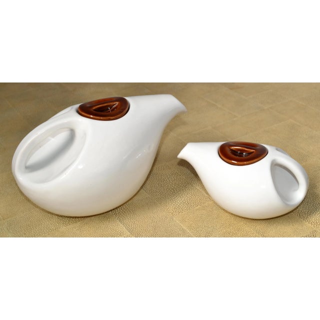 Life's cares seem to fade away and become more manageable over a steaming hot cup of tea. Here we offer a Set of 2 Teapots...