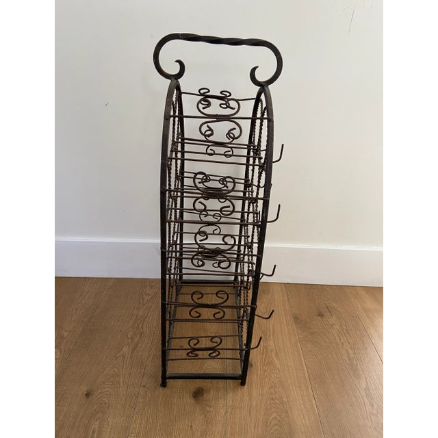 Wrought iron wine/bottle rack. Fits up to 14 bottles.
