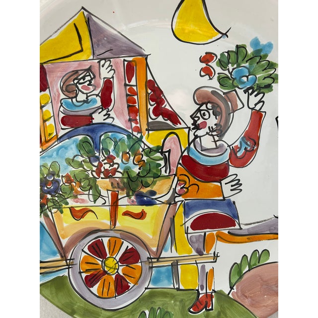 A charming piece of vintage Italian art pottery, this La Musa hand-painted terracotta serving platter captures a whimsical...