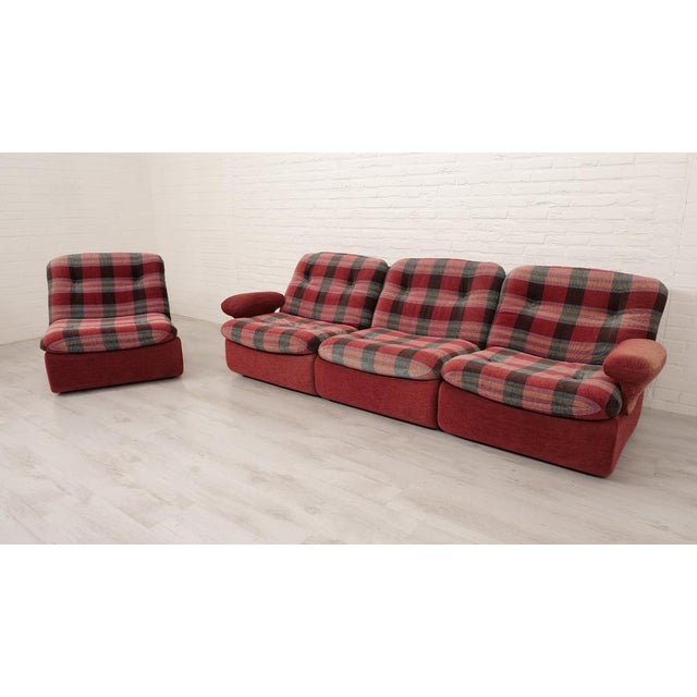 How bold is this vintage modular sofa? The sofa is made of a beautiful rust colour topped with cushions in an insane...
