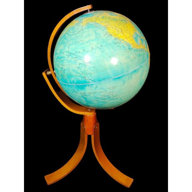 Large globe 50s the globe is in plastic and the foot in wood. 1950s. It has light. Good condition with centuries of use....