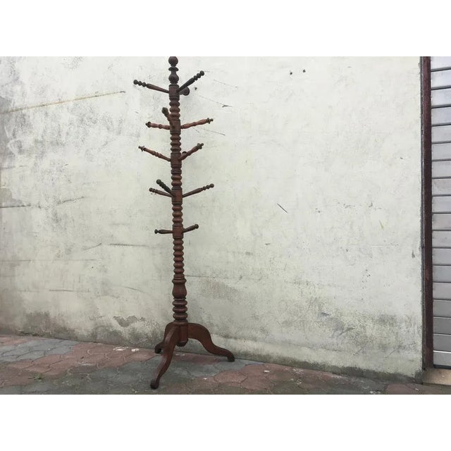 A free-standing wooden clothes stand from the 1930s. The middle part (with 15 arms) of this hanger. Good condition, traces...