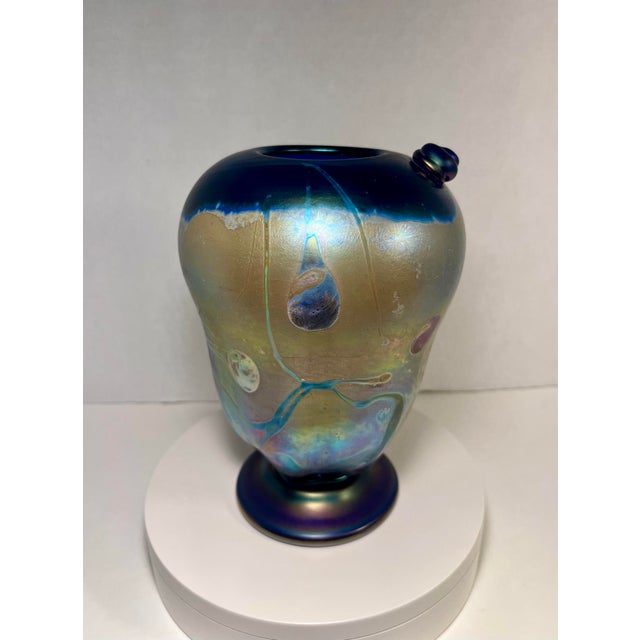 Offered is a beautiful 1988 studio art glass vase by acclaimed American glass artist Rick Hunter, showcasing his signature...