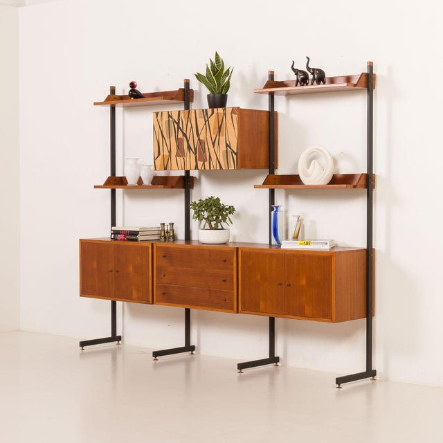 This italian freestanding wall unit or room divider was made some time in the late 1950s-1960s. Designed as a modular and...