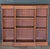 A fine English breakfront open bookcase of mahogany from the Edwardian era, featuring a frieze of three sections, with...