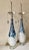 These striking Large Scale contemporary-style Lamps feature a hand-blown white glass body detailed with a distinct,...